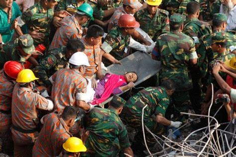 dhaka building collapse smiling woman survivor found in bangladesh factory rubble video