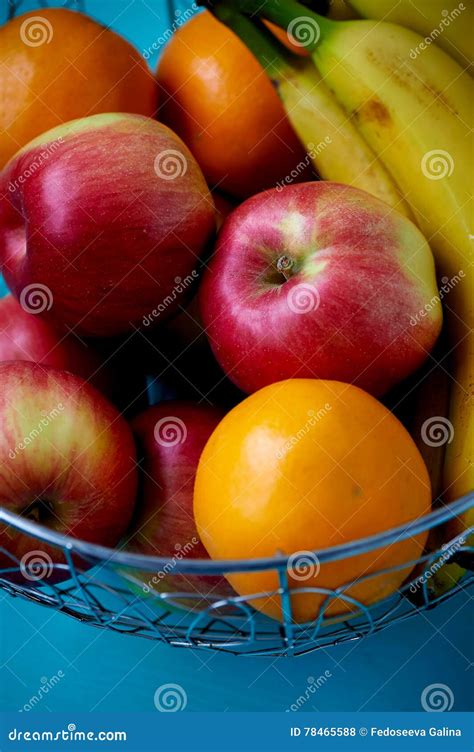 Metal Fruit Bowl On A Wooden Surface Close Bananas Oranges And