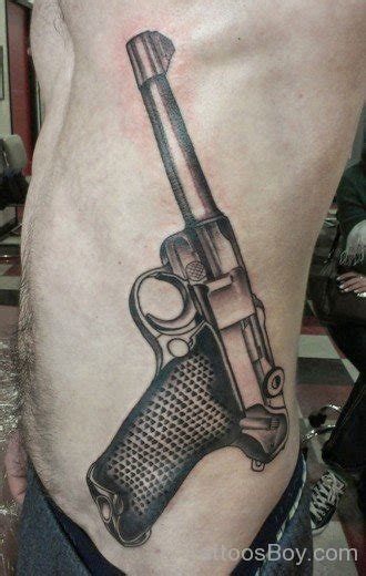 Attractive Gun Tattoo On Waist Tattoo Designs Tattoo Pictures