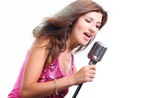 Beautiful Girl With A Microphone Singing A Song Royalty Free Stock