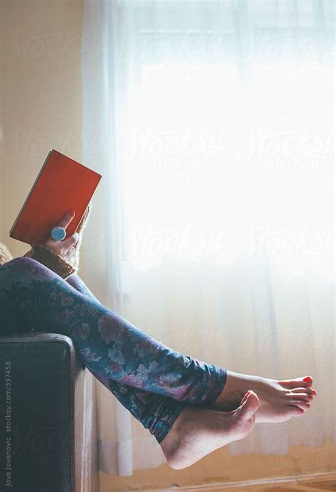 Woman Reading Book On Her Sofa By Stocksy Contributor Jovo Jovanovic Books To Read For