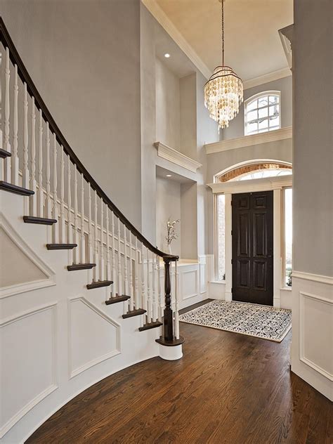 Traditional Gray Foyer With Spiral Staircase And Wall Panels Entryway