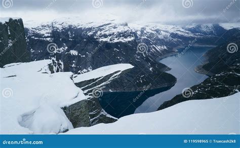 Trolltunga Under Snow Winter Landscape Of Troll Tongue Rock Formation