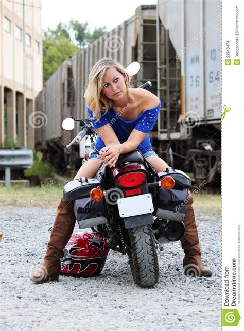 Marshall, we have one escapee heading your way on a motorcycle. Model on motorcycle stock photo. Image of riding, short ...