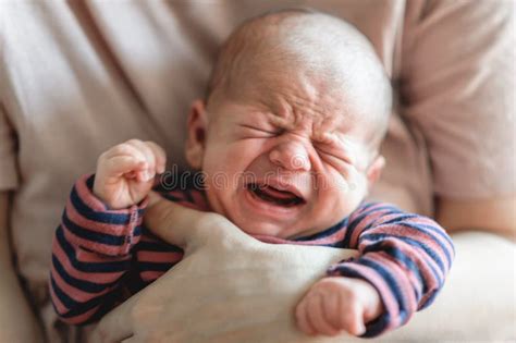 Sweet And Cute Small Little Newborn Baby Is Hungry And Upset And Cry