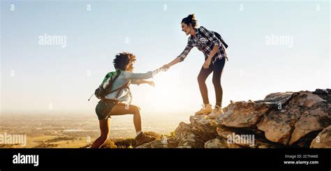 Friend Climb Hi Res Stock Photography And Images Alamy