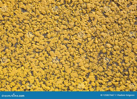 Yellow Paint On Surface Of Asphalt Road Markings Close Up Stock Image