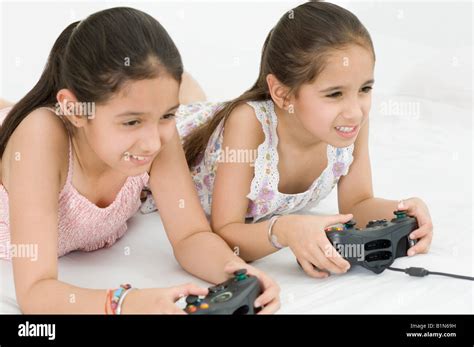 Two Girls Playing Video Game Stock Photo Alamy