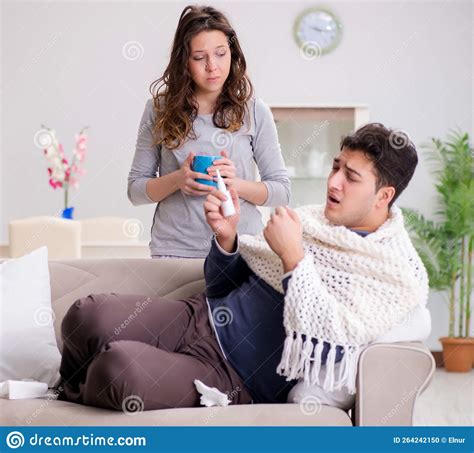 Wife Caring For Sick Husband At Home Stock Photo Image Of Blowing