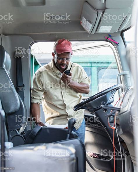 Africanamerican Truck Driver Entering Vehicle Stock Photo Download