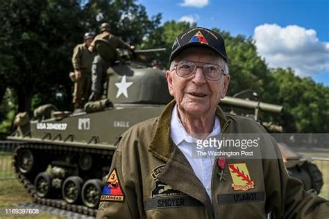 Clarence Smoyer Stands In Front Of A M4a3e8 Sherman Tank Near The