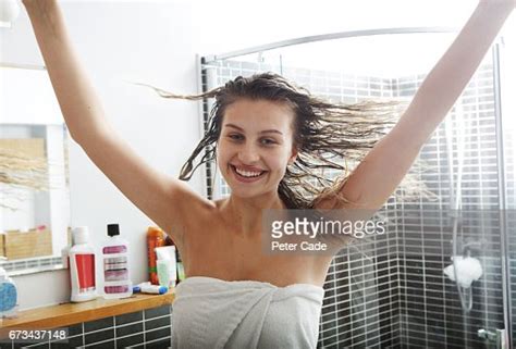 Young Woman In Bathroom After Shower Smiling Spinning Photo Getty Images
