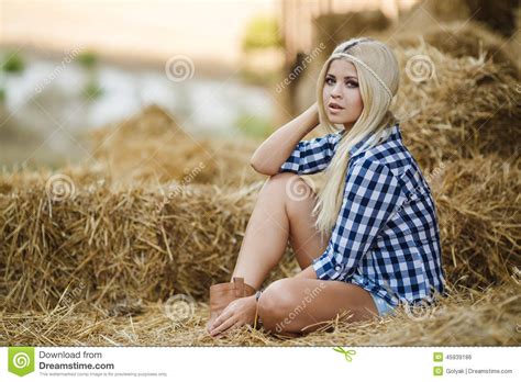 Blonde Woman Resting On Hay In Rural Areas Stock Photo Image Of
