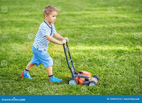 Happy 3 Year Old Boy Having Fun Mowing Lawn Stock Photo Image Of Baby
