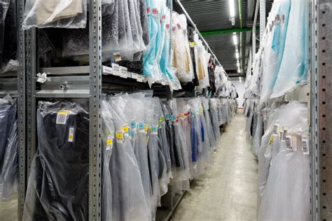 Clothes Are Hanging In The Large Warehouse Editorial Stock Image