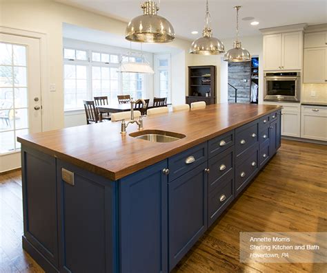 Our team of kitchen designers will help. Off White Cabinets with a Blue Kitchen Island - Omega
