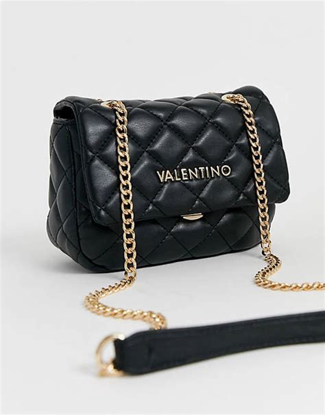 valentino bags ocarina quilted cross body bag with chain strap in black asos