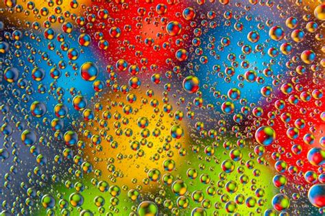 Premium Photo Colored Drops Of Water On Glass Abstract Background