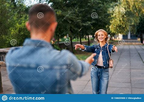 Happy Meeting Of Two Lovers Hugging In The Street Stock Photo Image