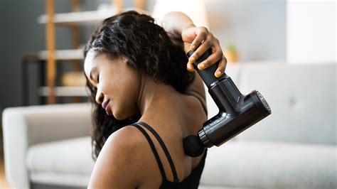 Should You Use A Massage Gun For Back Pain Techradar