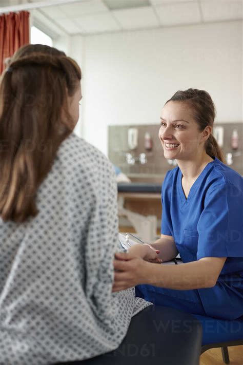 Nurse Talking To Patient Stock Photo