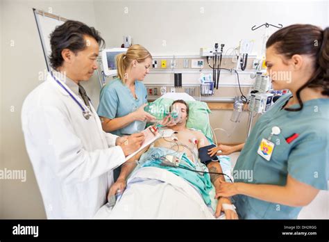Medical Team Treating Critical Patient Stock Photo Alamy