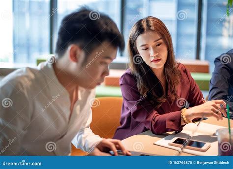 Asian Colleagues Discussing In Meeting Room Stock Image Image Of