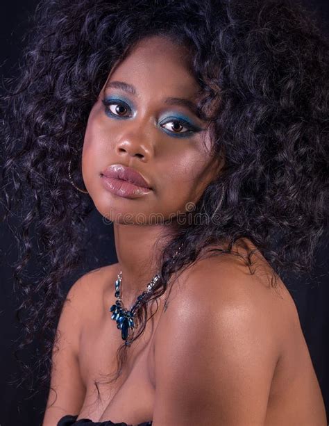 Extreme Close Up Of Beautiful Young African Model With Curly Big Hair Full Lips And Blue Make