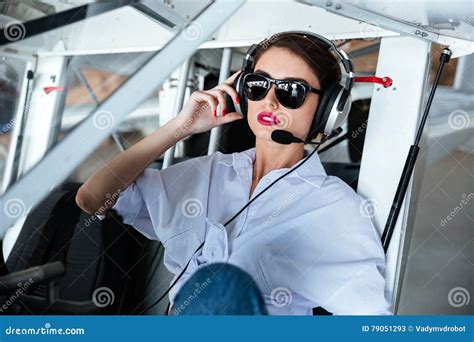 Attractive Woman Pilot In Sunglasses And Headset Sitting In Aircraft Stock Image Image Of