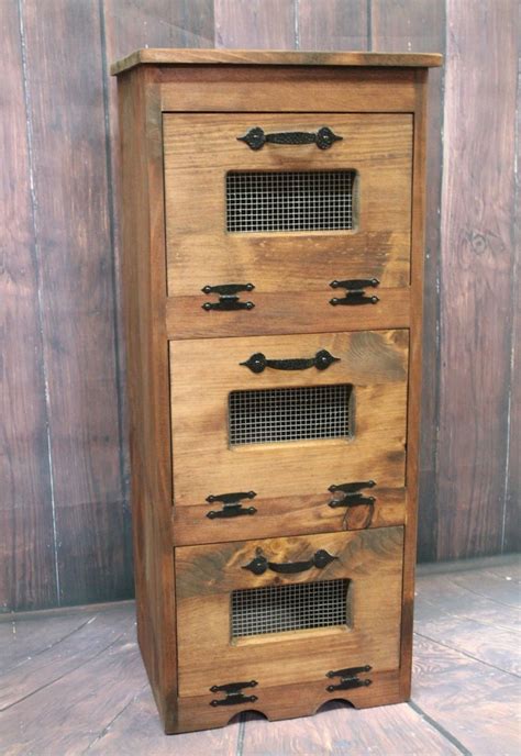 This potato bin is the ideal choice if you want to combine utility with the looks, as the cupboard has a beautiful design. Where to buy Wood Vegetable Bin Potato Storage Rustic ...