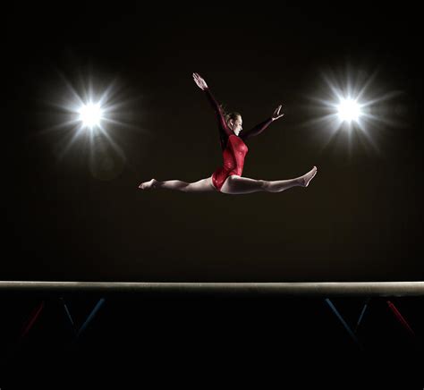 Female Gymnast Doing Mid Air Splits Photograph By Mike Harrington