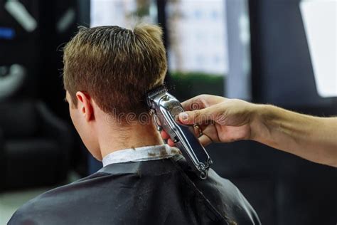 Male Haircut With Electric Razor Barber Makes Haircut For Client At