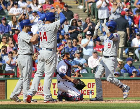 baez hits 2 hrs as cubs open season with 12 4 win at rangers ap news
