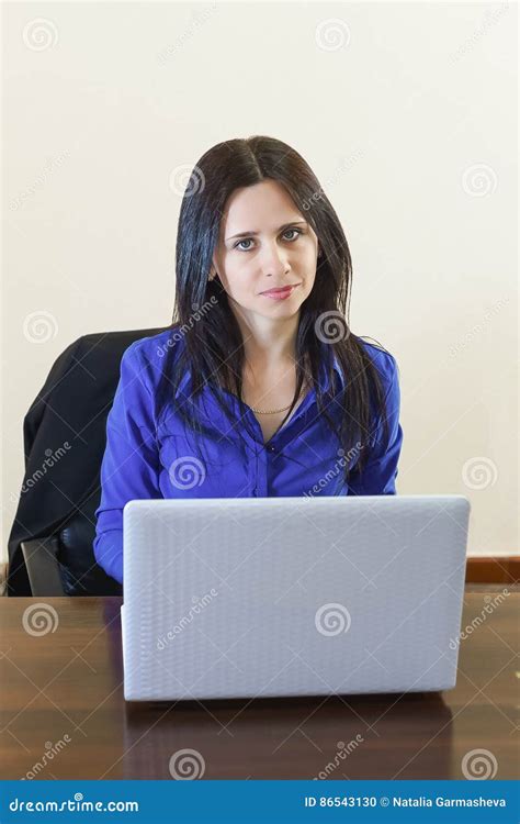 Young Beautiful Business Woman In Office Working On White Laptop Stock