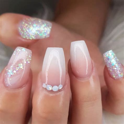 If you look at your fingers from the side, the whites of the nails shouldn't be so long that they start to divorce the rounded shape of the finger. How do you make a set of ombré nails even better??? Just ...