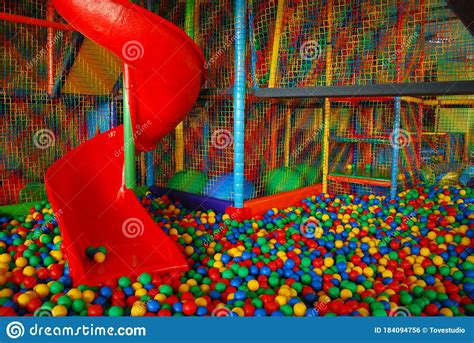 Indoor Playground For Kids And Baby With Big Red Slide Stock Photo