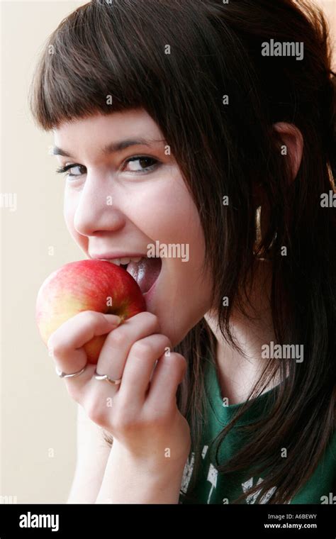 Teenage Girl Eating Apple Stock Photo Alamy