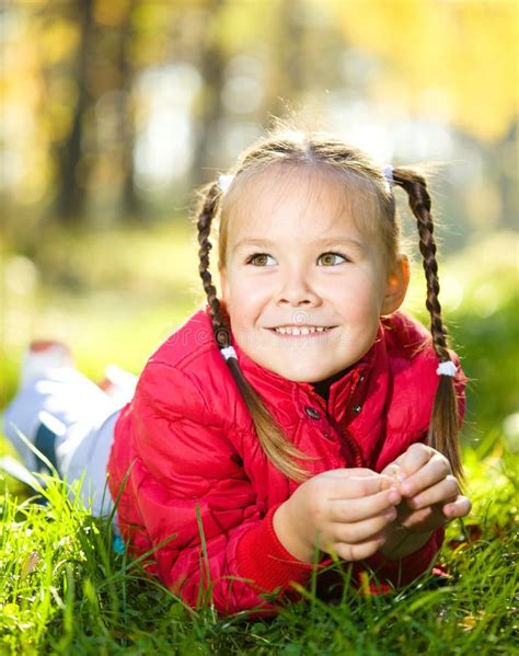 Portrait Of A Little Girl In Autumn Park Stock Photo Image Of Fall