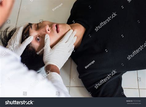 Doctor Detective Checking Left Eye During Stock Photo 772191961
