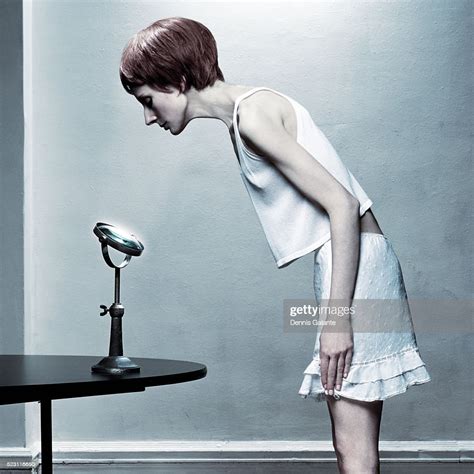 Skinny Woman Looking Into Mirror Photo Getty Images