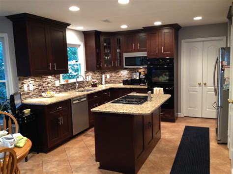 Maybe you would like to learn more about one of these? Dark Maple Cabinets w/ Medium Granite and Luxury Vinyl ...