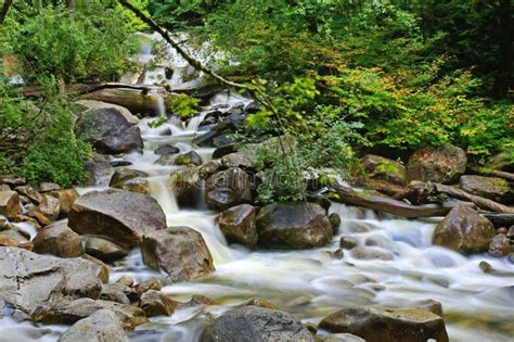 Rushing Water Over Rocks In A Creek Stock Photos Image 25822723