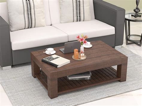 The large table has two opening which allows for brown coffee table with beautiful designs on it & glass top. Coffee Table Design |Center Table | Wooden Coffee Table ...