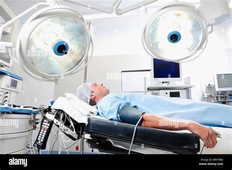 Patient Lying Down On An Examination Table Hi Res Stock Photography And