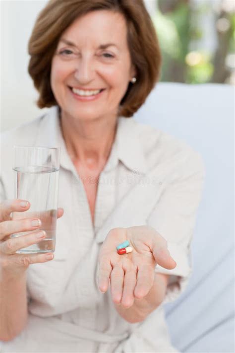 Cute Mature Woman With Pills Royalty Free Stock Images Image 18108059
