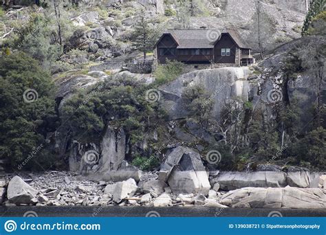 Cabin On A Cliff Above A Late In Yosemite National Park