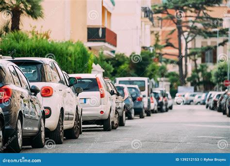 Cars Parked On Street In European City In Sunny Summer Day Stock Image