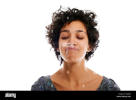 Hispanic Woman Doing Facial Expression And Touching Nose With Tongue On