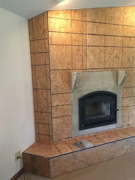 Learn how to prep the old brick and fireplace surround, and how to tile a fireplace for a fresh, modern look! New fireplace insert framed in and ready to have faux ...