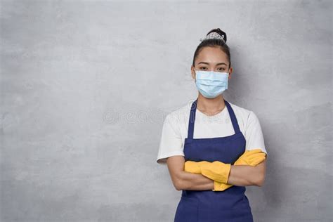 Confident Cleaning Lady Wearing Rubber Gloves And Medical Protective
